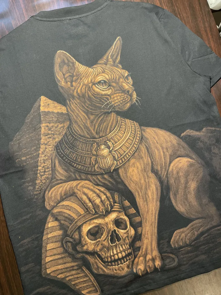 Egyptian sphynx cat bleach art illustration on the back of a black t-shirt