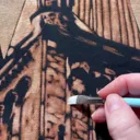 Live video showing a gothic architecture bleach art design on the back of a hoodie