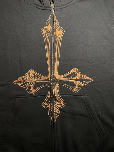 Front view of baroque inverted cross hand-painted bleach art on black hoodie