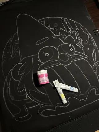 Chalk sketch of a rainbow gnome illustration inspired by Gravity Falls on the back of a hoodie