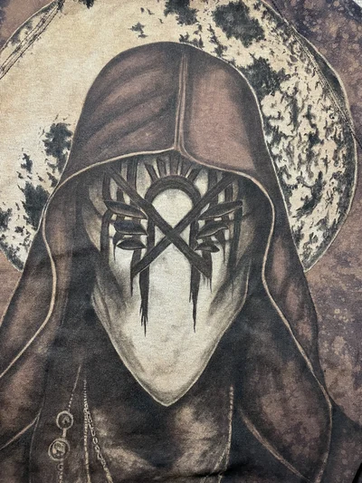 Close up of the painted Vessel mask, hood and facial details on the back of the Sleep Token sweatshirt