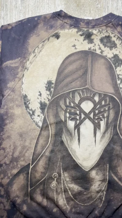 Close view of the hand painted Vessel portrait on the Sleep Token sweatshirt