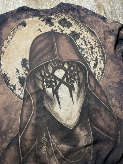 Closer view of the Vessel portrait and textured moon on the back of the hand painted Sleep Token sweatshirt