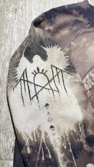 Sleep Token logo and rune sleeve design shown together with the front of the sweatshirt