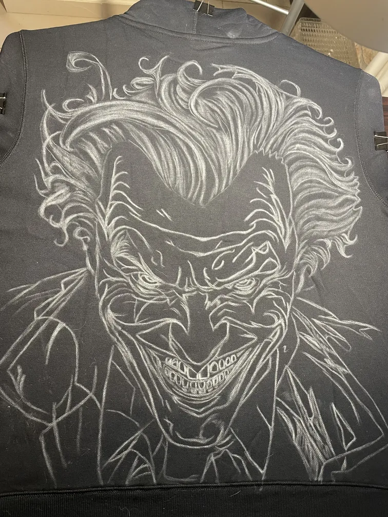 Chalk sketch of a joker-inspired villain artwork during the design process