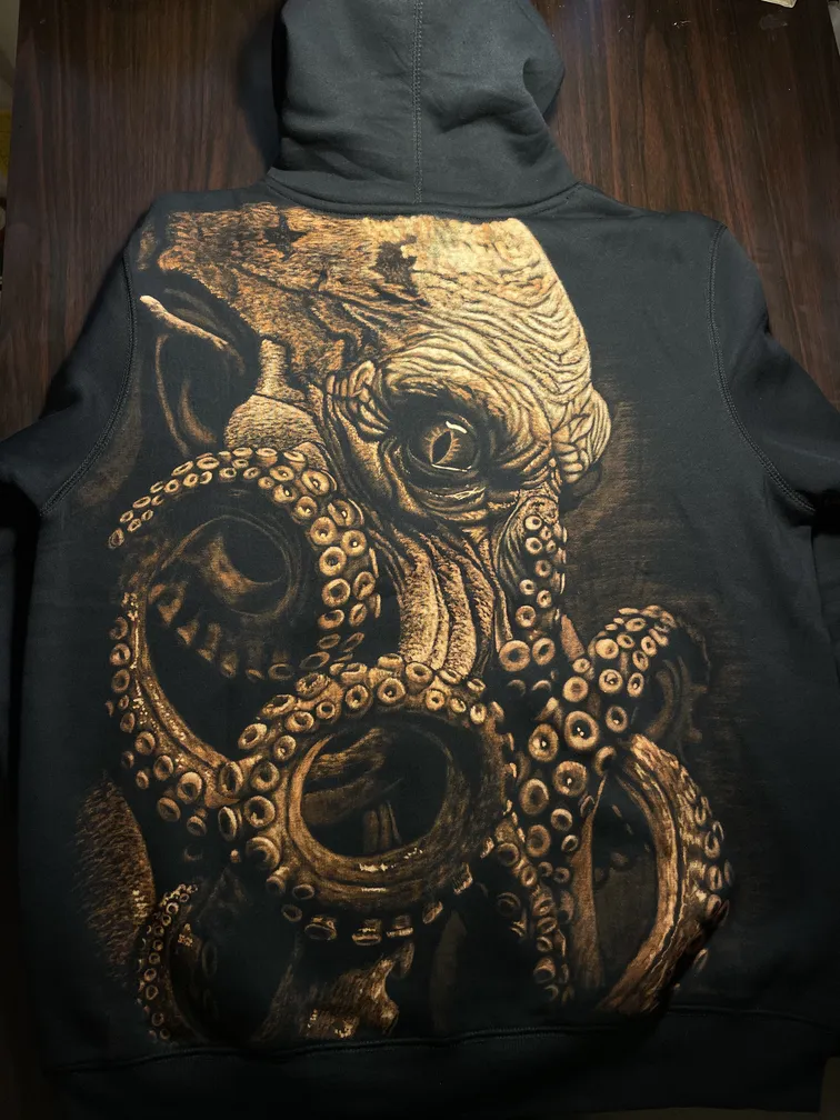 Kraken bleach art illustration covering the back of a black fleece hoodie
