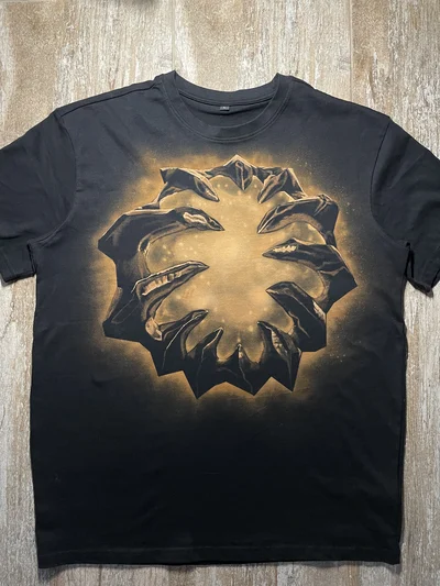 Full front view of a black oversized T-shirt with a handmade Aegis of the Immortal bleach art design