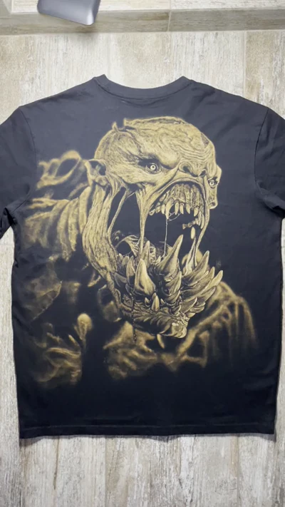 Video showing the full back of a black oversized T-shirt with a handmade Lifestealer Dota 2 bleach art design