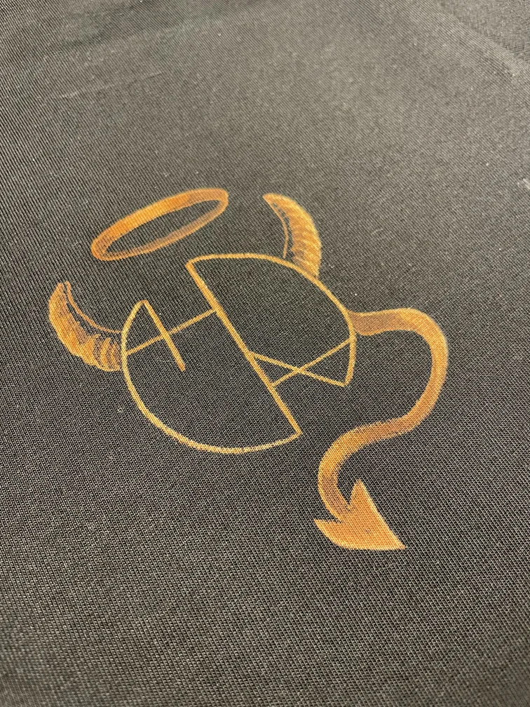 lose-up of the Helen Oben Art logo with a halo, demon horns, and a small devil tail