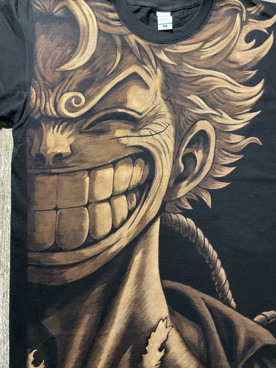 Close-up of hand-painted Luffy Gear 5 One Piece bleach art shirt with detailed anime design