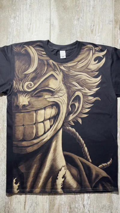 Video of hand-painted Luffy Gear 5 bleach art T-shirt featuring full front One Piece anime design