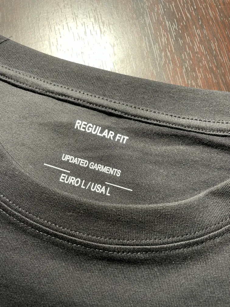 Close-up of the size label showing US size L on the mermaid t-shirt