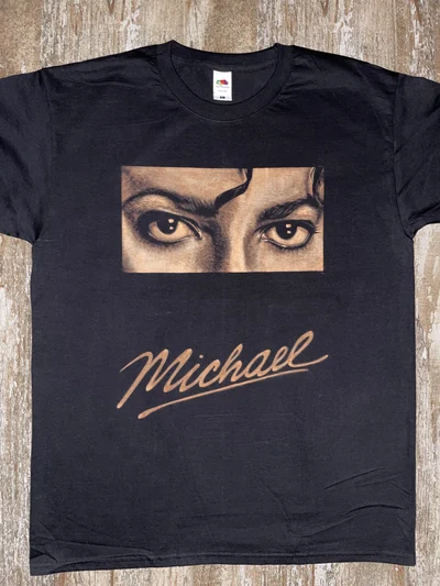 Close-up front view of a Michael Jackson Bleach Art T-shirt featuring his eyes and signature
