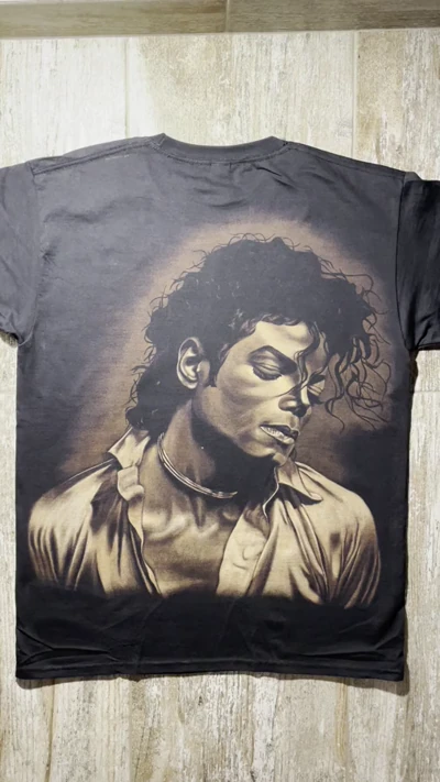 Video showing the back of a Michael Jackson Bleach Art T-Shirt with a large hand-painted portrait