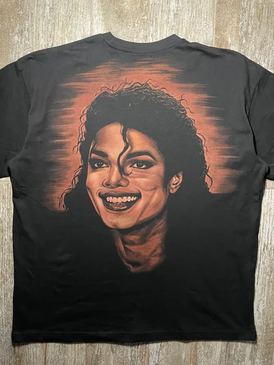 Full back view of an oversized Michael Jackson T shirt with a hand painted smiling bleach art portrait
