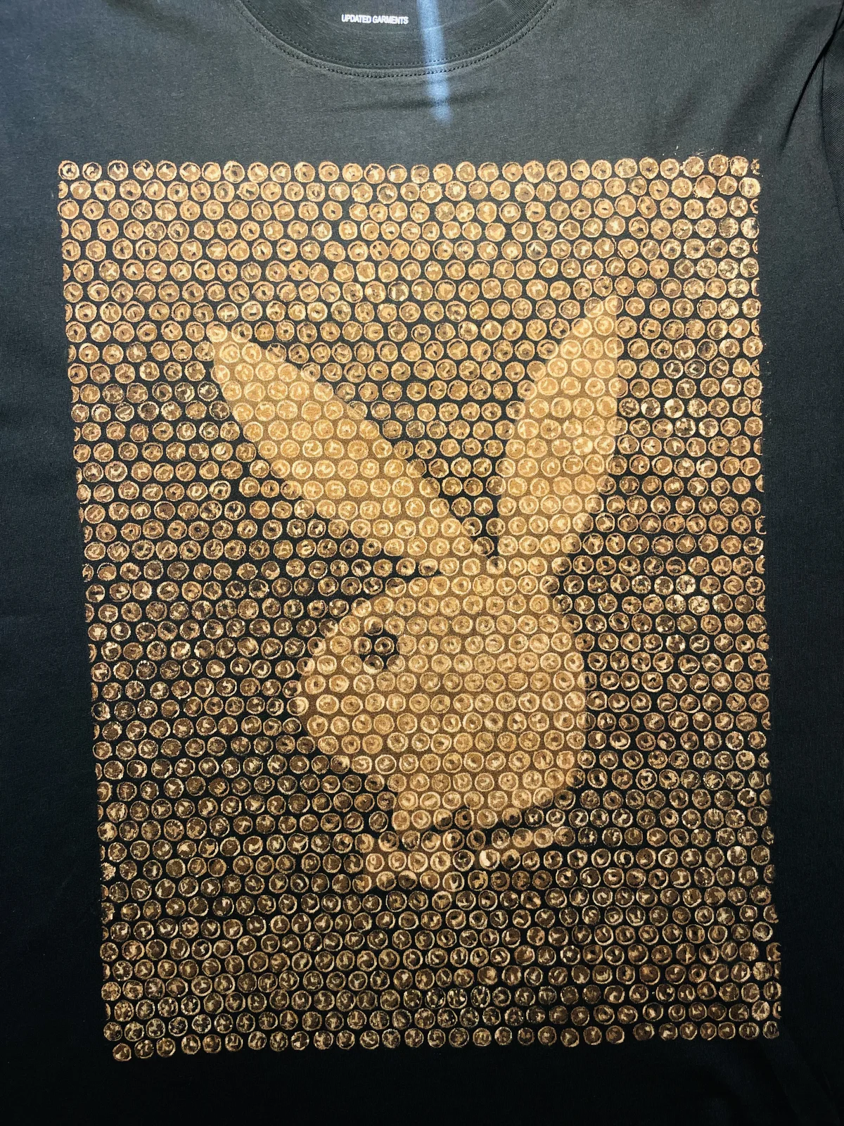 Front view of a hand-painted bleach art t-shirt featuring a bubble wrap style bunny design inspired by Playboy