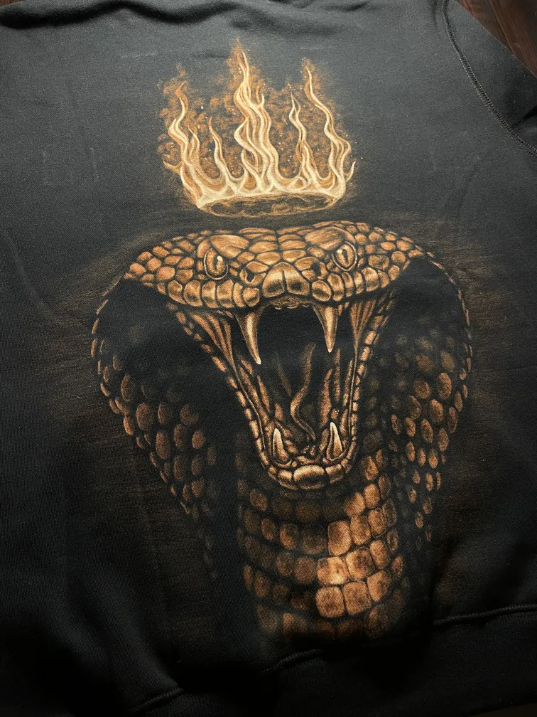 Royal cobra bleach art illustration covering the back of a black hoodie
