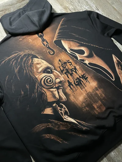 Angled close up of the Saw and Scream inspired back design featuring Ghostface and Billy the Puppet