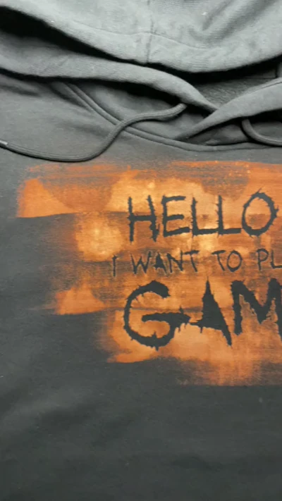 Close up video of the bleach art cassette and horror quote on the front of a black hoodie