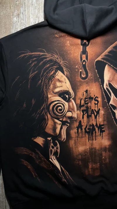 Full back view of a black bleach art hoodie with Ghostface, Billy the Puppet and the words I Want to Play a Game