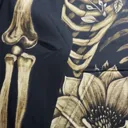 Video showing the finished hand painted skeleton and magnolia zip hoodie design