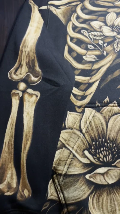 Video showing the finished hand painted skeleton and magnolia zip hoodie design