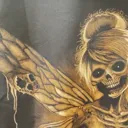 Daylight close-up video showing skeleton fairy bleach art details on a hoodie