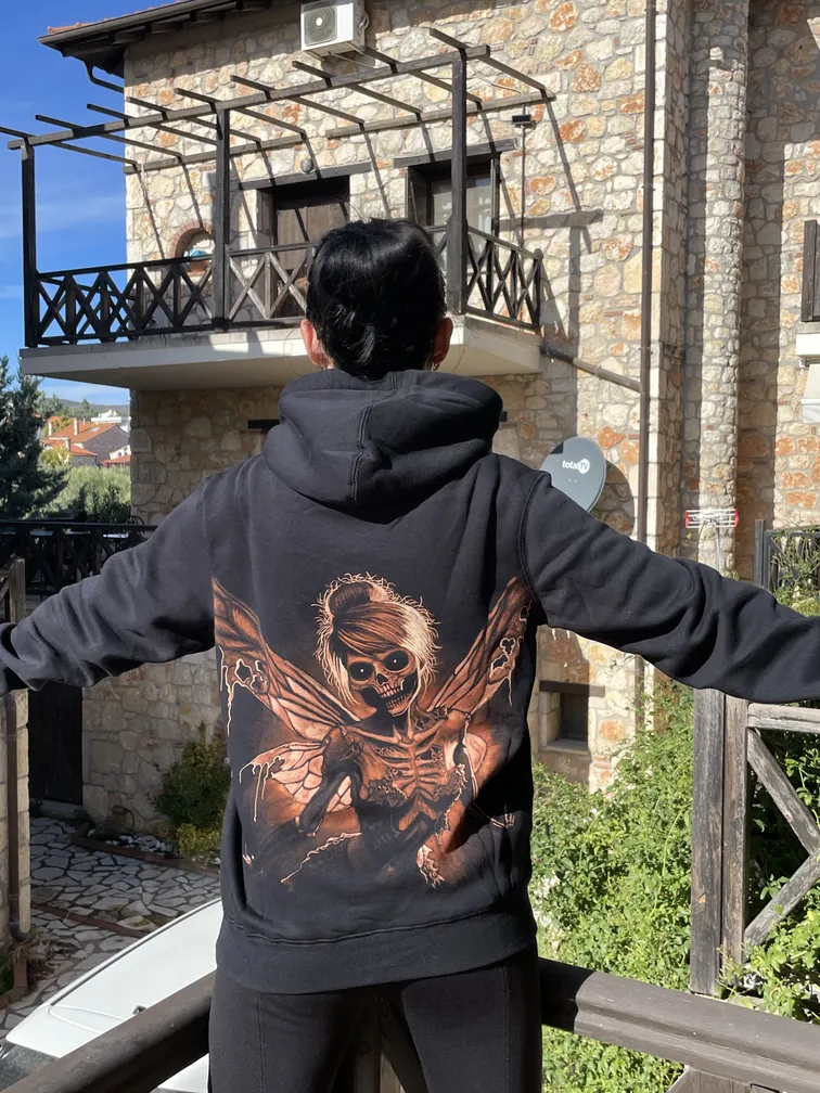 Daylight view of a skeleton fairy bleach art design on the back of a hoodie