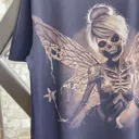 Daylight video showing the skeleton fairy bleach art design on the back of the t-shirt
