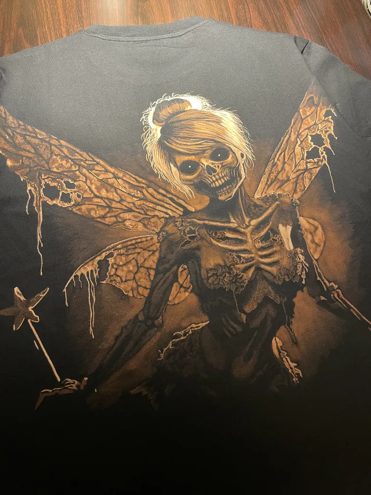 Skeleton fairy bleach art illustration on the back of a black t-shirt
