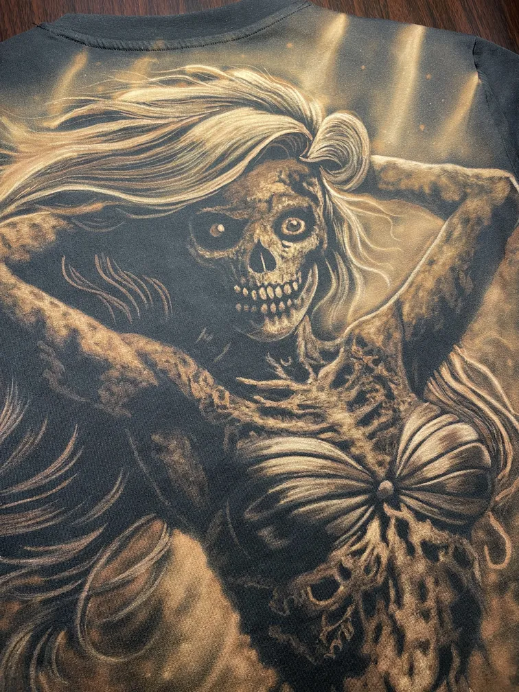 Close-up of a skeletal mermaid illustration in dark fantasy bleach art style