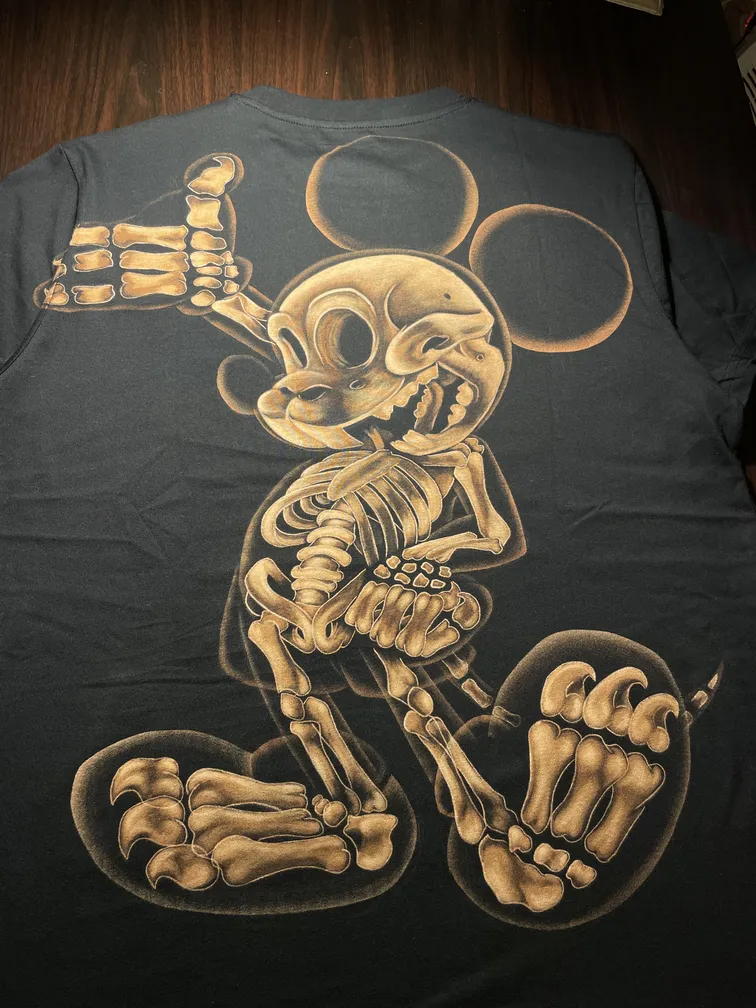 Skeleton mouse bleach art illustration in x-ray style covering the back of a black t-shirt
