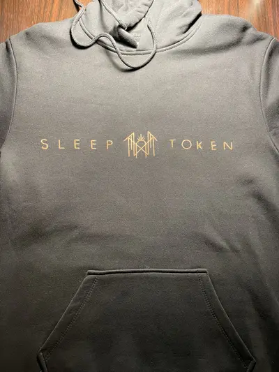Front view of a black fleece hoodie with Sleep Token inspired text and logo, full view