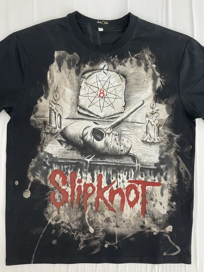 Full front view of the black Slipknot T-shirt with a hand-painted Chris Fehn mask design