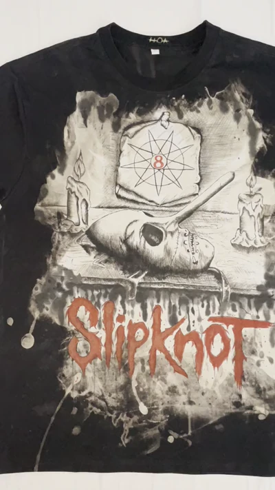 Video showing the front of a Slipknot T-shirt with a hand-painted Chris Fehn mask design