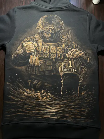 Hand-painted bleach art hoodie with a soldier illustration covering the full back, military symbolism on black cotton hoodie