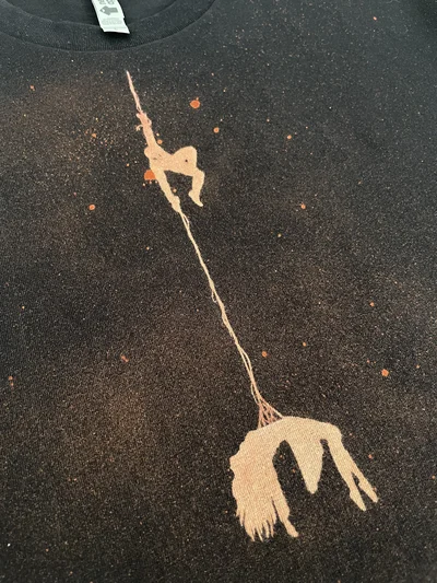 Close-up of the front design showing Spider-Man rescuing a girl with his web
