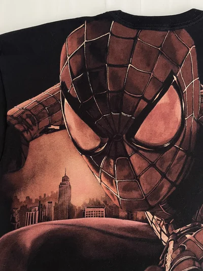 Close-up of the large Spider-Man bleach art design on the back of the black T-shirt