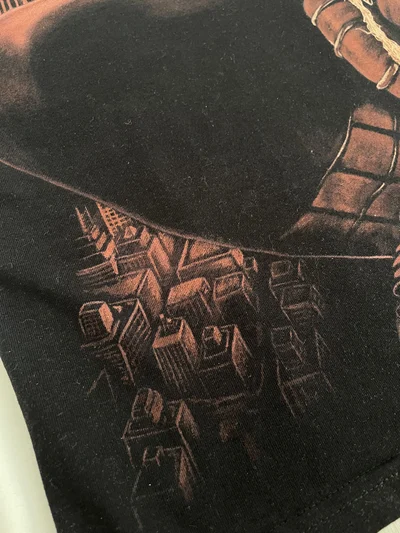 Close-up of the lower details of the Spider-Man bleach art design on the back of the T-shirt