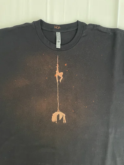 Full front view of the Spider-Man T-shirt with a miniature rescue scene