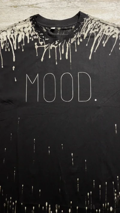 Video of black bleach art raccoon shirt front with MOOD print