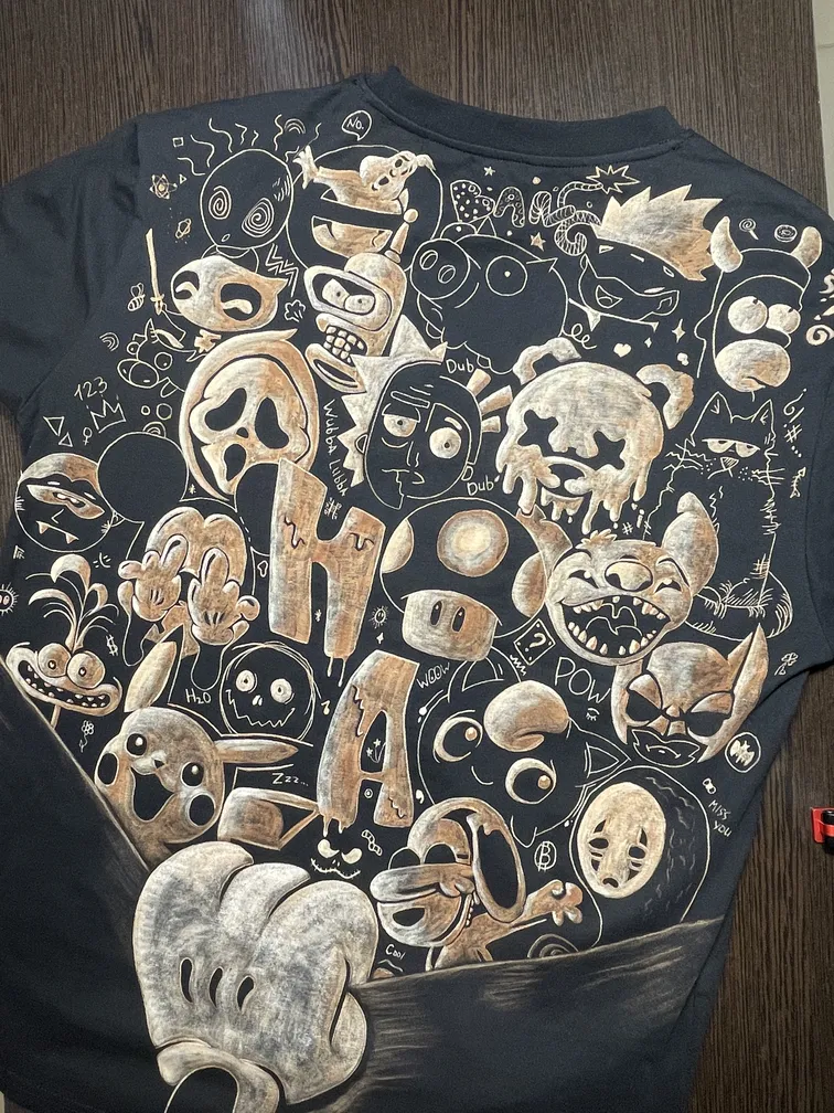 Sticker collage bleach art illustration covering the back of a black t-shirt