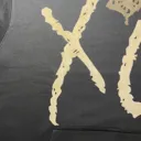 XO logo bleach art hoodie detail in natural light