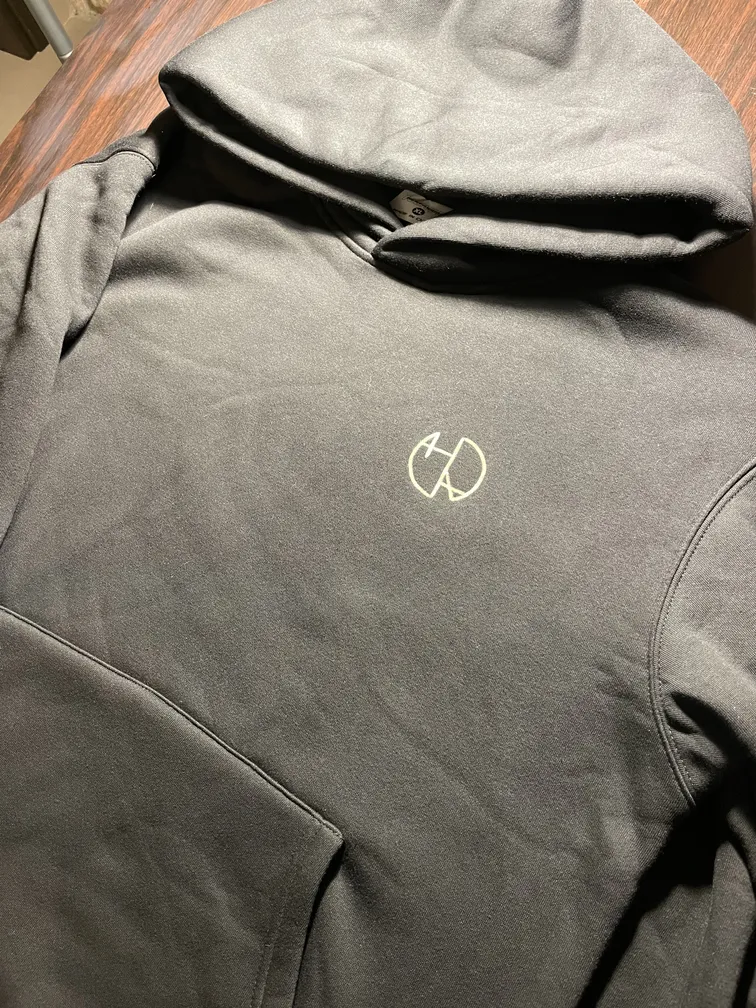 Front view of a hoodie with the Helen Oben Art logo