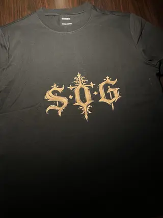 Front view of a t-shirt with S.O.G initials painted in gothic style