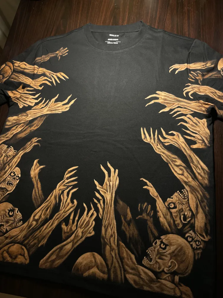 Angled view of a t-shirt with a zombie hands bleach art illustration