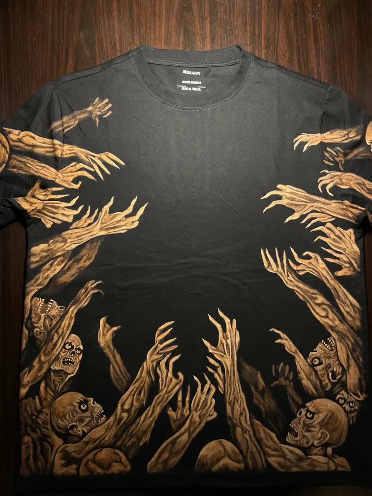 Front view of a black t-shirt featuring multiple zombie hands in bleach art style