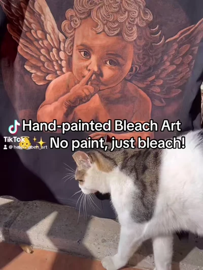 Cupid Bleach Art auf schwarzem T-Shirt – geflügeltes Kind Designprozess