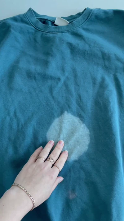Fixing a Bleach Stain on a Blue Sweatshirt with a Painted Bunny Design